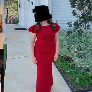 Red flutter sleeve long dress.